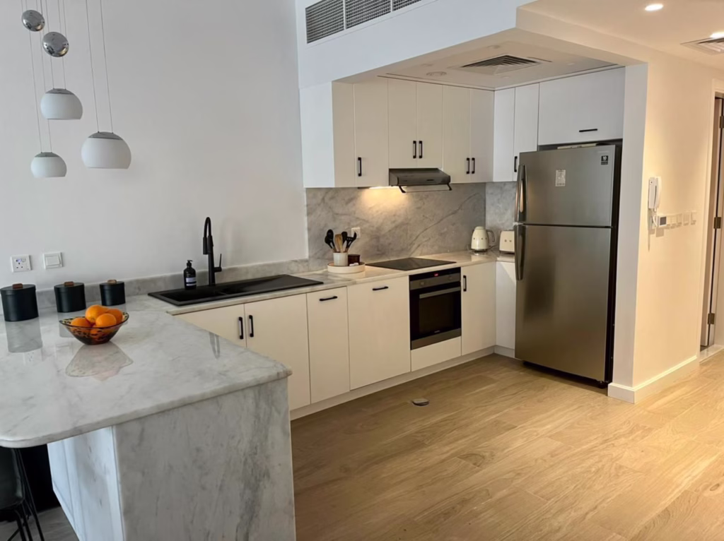 Elegant kitchen design for an Al Hamra townhouse project