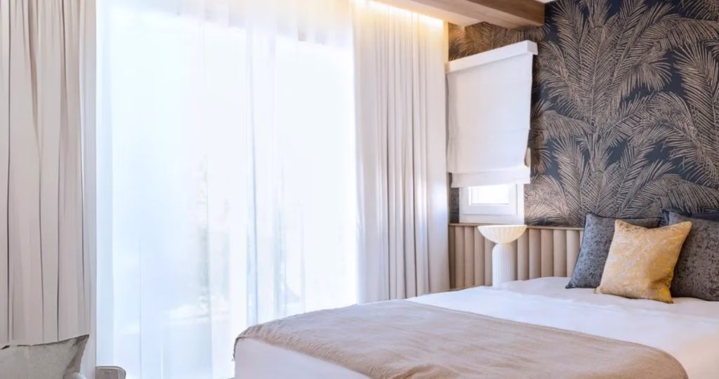 Blackout curtains and soft neutral colours creating a spa-like bedroom retreat