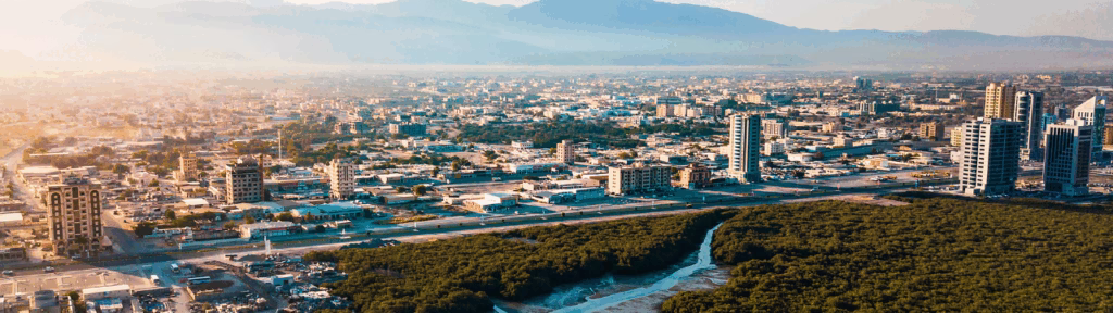 Aerial view of Ras Al Khaimah city showing modern office buildings and commercial developments in the UAE business hub.