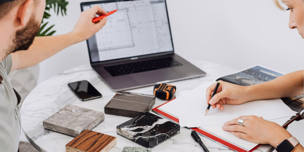 Happy homeowner reviewing design samples with interior designer, enjoying the process of creating their dream home – common client questions interior designers answer