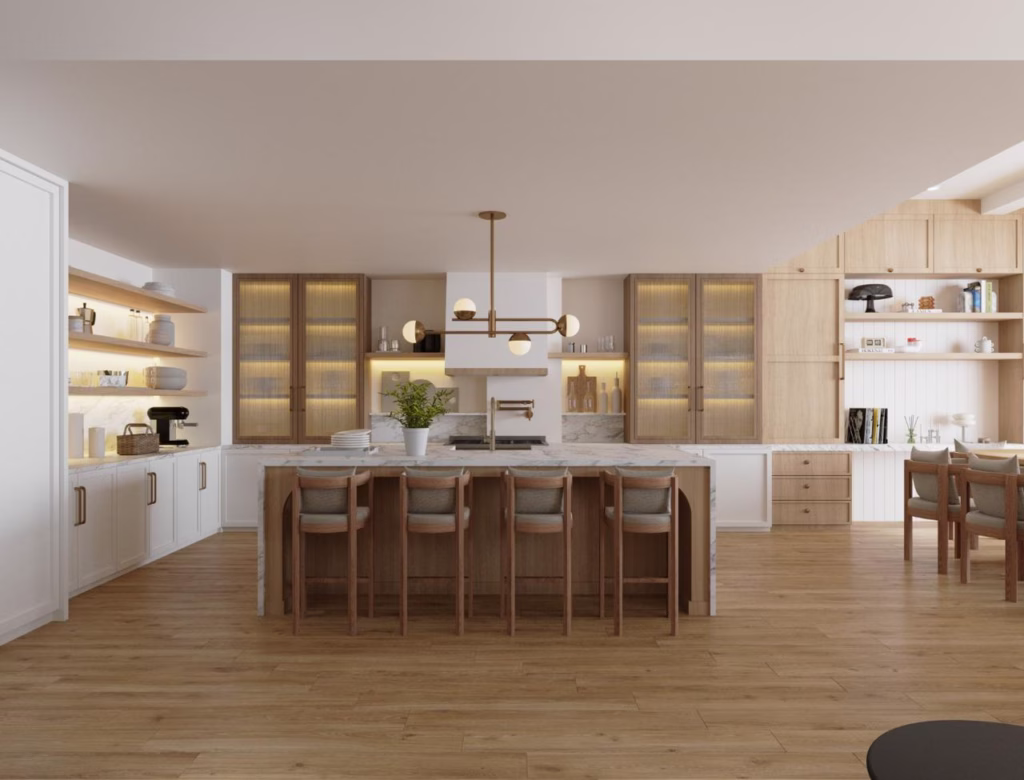 Direct view of a bespoke luxury show kitchen featuring a marble-wrapped island, modern brass light fixture, and integrated oak panelled kitchen storage.